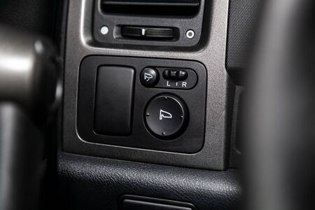 Close-up of the  buttons: side mirror adjustment buttons. modern car interior, soft focusの写真素材