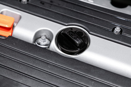 Close up of the oil filling plug in car engine compartment. Neck of engine for engine oil.