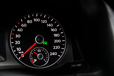 Car dashboard wuth white backlight: Odometer, speedometer, tachometer, fuel level, water temperature...