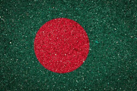 National flag of Bangladesh on a stone background.The concept of national pride and symbol of the country.