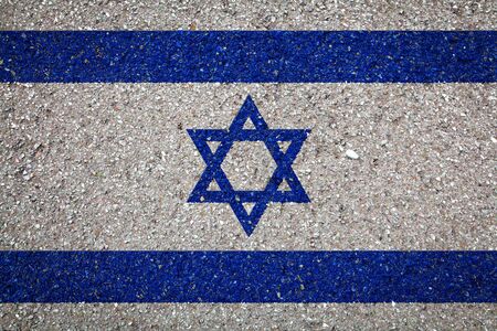 National flag of Israel on a stone background.The concept of national pride and symbol of the country.の写真素材