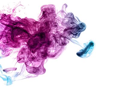 Frozen abstract movement of  explosion smoke multiple blue and pink colors on white background. Background from the smoke of vapeの写真素材