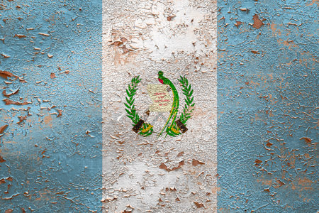 National flag of Guatemala on old peeling wall background.The concept of national pride and symbol of the country.の写真素材
