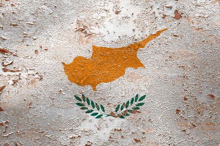 National flag of Cyprus  on old peeling wall background.The concept of national pride and symbol of the country.の写真素材