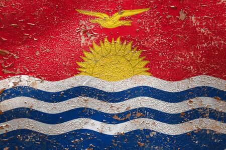 National flag of Kiribati on old peeling wall background.The concept of national pride and symbol of the country.の写真素材