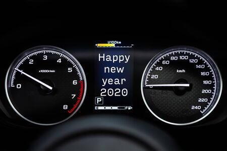 Close up Instrument automobile panel with Odometer, speedometer, tachometer, fuel level, which says Happy New Year 2020. The concept of the new year and Christmas in the automotive field
の写真素材