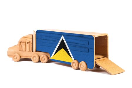 Close-up of a wooden toy truck with a painted national flag Saint Lucia
. The concept of export-import,transportation, national delivery of goodsの写真素材