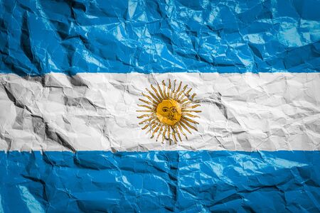 National flag of Argentina on crumpled paper. Flag printed on a sheet. Flag image for design on flyers, advertising.の写真素材