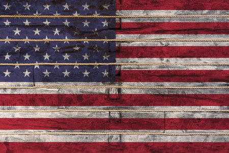 National flag  of USA on a wooden wall background. The concept of national pride and a symbol of the...