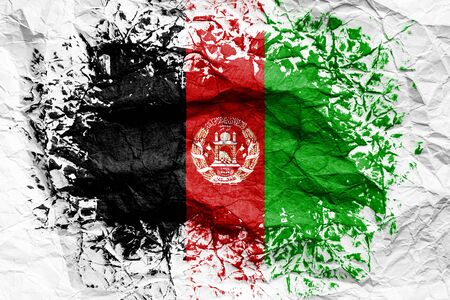 The national flag of the Afghanistan
 is painted on crumpled paper. Flag printed on the sheet. Flag image for design on flyers, advertising.の写真素材