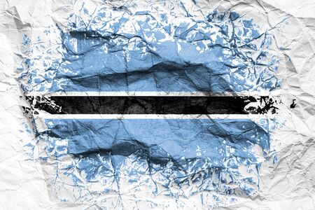 The national flag of the Botswana is painted on crumpled paper. Flag printed on the sheet. Flag image for design on flyers, advertising.の写真素材