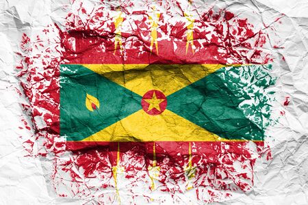 The national flag of the Grenada  is painted on crumpled paper. Flag printed on the sheet. Flag image for design on flyers, advertising.の写真素材