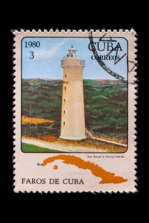 Novosibirsk, Russia - January 07, 2020: stamp  Faro collection printed in  Cuba  shows white stone  lighthouse Faro Roncali  on a warm lazy day, amid bright blue sun ,  a postage stamp circa 1980のeditorial素材