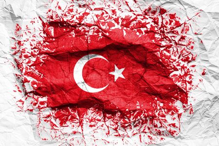 The national flag of the Turkey is painted on crumpled paper. Flag printed on the sheet. Flag image for design on flyers, advertising.の写真素材