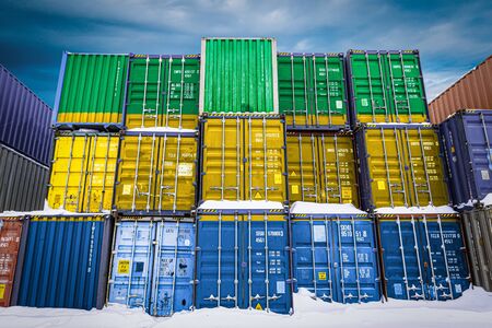 The national flag of Gabon
 on a large number of metal containers for storing goods stacked in rows on top of each other. Conception of storage of goods by importers, exportersの写真素材