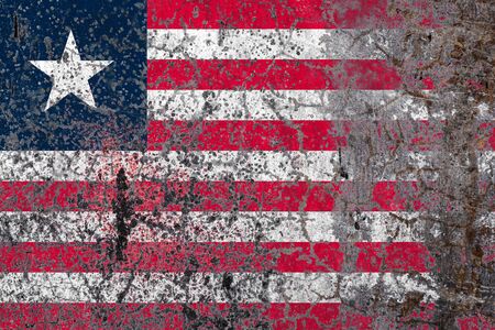 National flag of Liberia on old peeling wall background.The concept of national pride and symbol of the country.の写真素材