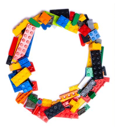 Arabic numeral "0"  from multi-colored children's plastic constructor on a white isolated background.  Bright alphabet for kids designの写真素材
