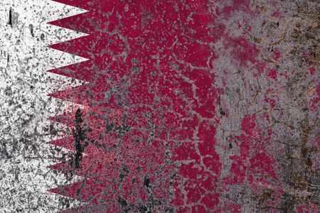 National flag of Qatar on old peeling wall background.The concept of national pride and symbol of the country.の写真素材
