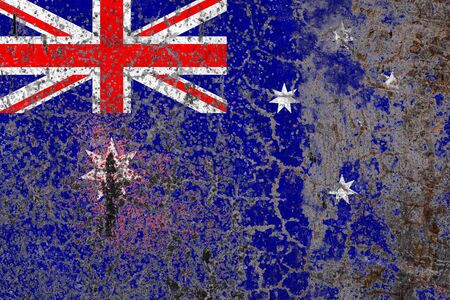 National flag of Australia on old peeling wall background.The concept of national pride and symbol of the country.の写真素材
