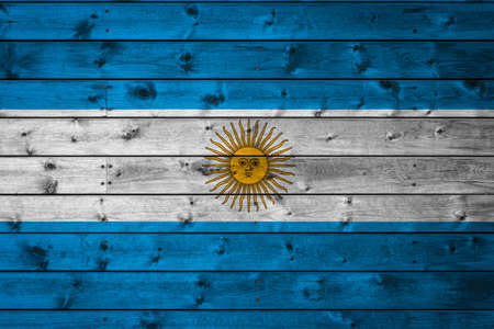 The national flag of Argentina is painted on a camp of even boards nailed with a nail. The symbol of the country.の写真素材