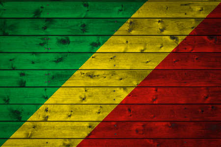 The national flag of Republic of the Congo is painted on a camp of even boards nailed with a nail. The symbol of the country.の写真素材