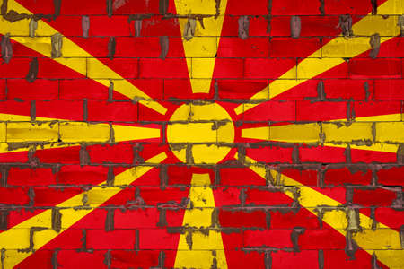 The national flag of Macedonia painted on a wall of sibit blocks with cement. The symbol of the country.の写真素材