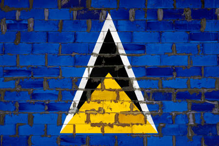 The national flag of Saint Lucia painted on a wall of sibit blocks with cement. The symbol of the country.の写真素材