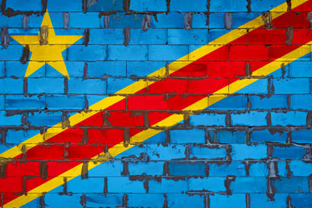 The national flag of Democratic Republic of the Congo painted on a wall of sibit blocks with cement. The symbol of the country.の写真素材