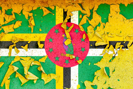 The national flag of Dominica is painted on an old metal wall with ragged paint. Country symbol.の写真素材