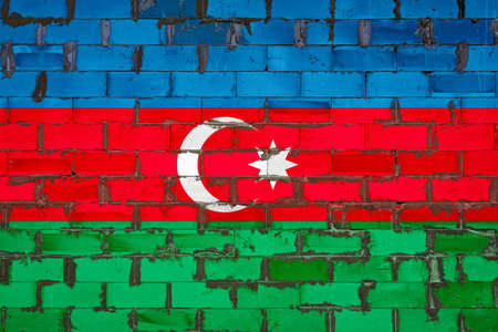 The national flag of Azerbaijan painted on a wall of sibit blocks with cement. The symbol of the country.の写真素材
