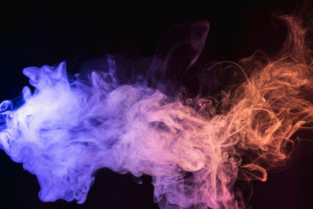 Abstract blue, red and purple smoke on black isolated background. Stop the movement of multicolored...