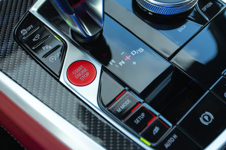 Car engine push start stop button ignition remote starter. Car dashboard: red engine start stop...