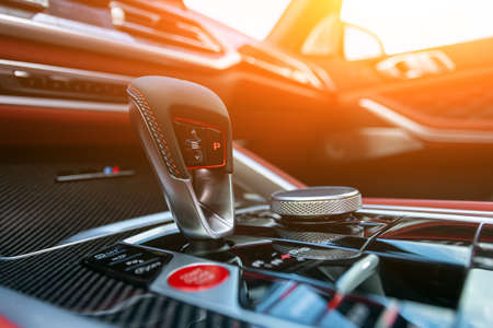Car detailing.Chrome automatic transmission lever shift. Accelerator handle and parking buttons, softの写真素材