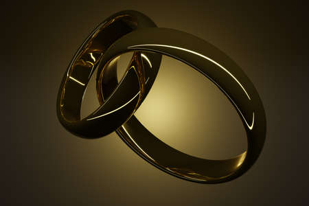 3d rendering of a pair of gold rings isolated on a dark background. Symbol of love and fidelity, union of loversの写真素材