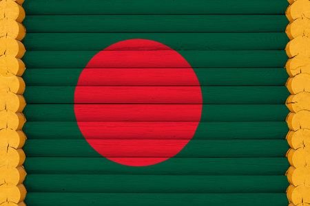 National flag of Bangladesh on a wooden wall background. The concept of national pride and a symbol of the country. Flags painted on a houseの写真素材