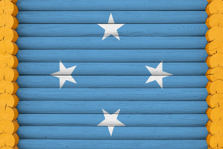 National flag of Federal States of Micronesia on a wooden wall background. The concept of national pride and a symbol of the country. Flags painted on a houseの写真素材