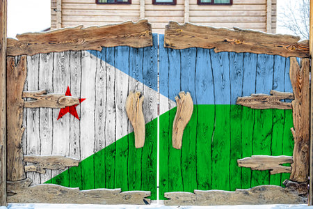 Close-up of the national flag of Djibouti on a wooden gate at the entrance to the closed territory. The concept of storage of goods, entry to a closed area.の写真素材