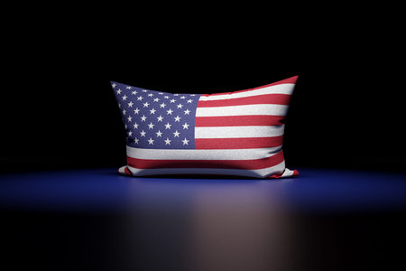 3d illustration of rectangular pillow depicting the national flag of USA under red light on black...
