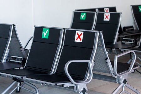 Close-up of a waiting room at the airport, train station with comfortable soft chairs with armrests...