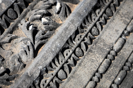 Close-up pattern on antique stone column.Elements of ancient Greek architecture. Detail of the facade of the city buildingの写真素材