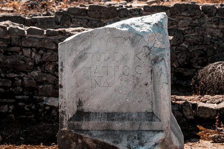 Close-up of a part of the wall, an obelisk with the inscription Patros in the ancient ruined city...
