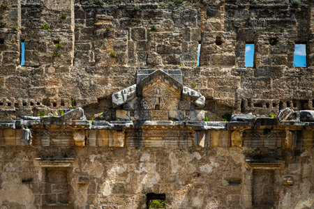 The walls of the old amphitheater remember a lot. ancient reliefs on the stone walls of the...