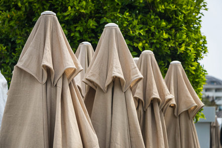 Close-up of fabric covered umbrellas protecting from the sun on the beach