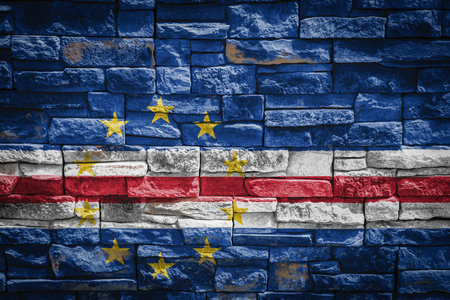 National flag of Cape Verde on stone wall background. The concept of national pride and symbol of...
