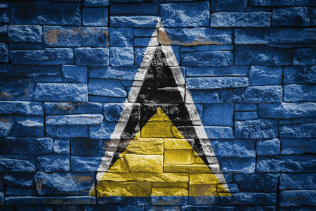 National flag of Saint Lucia on stone wall background The concept of national pride and symbol of the country. Flag banner on stone texture background.の写真素材