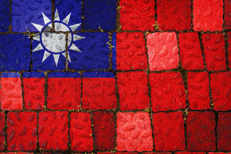 National flag of Taiwan on stone wall background. Flag banner on stone texture background.の写真素材