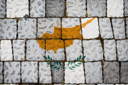 National flag of Cyprus on stone wall background. Flag banner on stone texture background.の写真素材