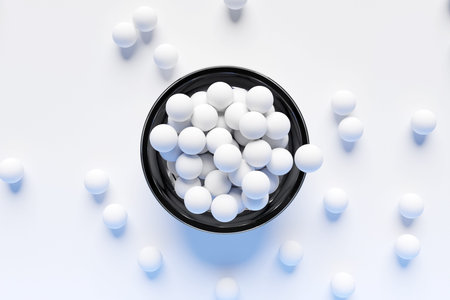 3d illustration of small plate with white balls on a white background. A treat for the kids. Round...