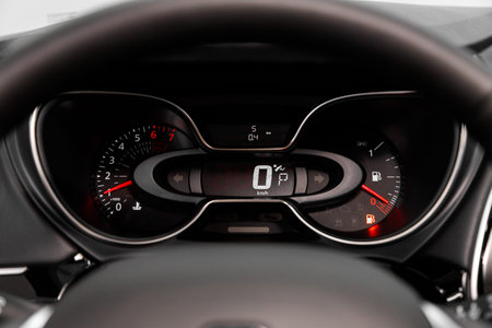 dashboard of the car is illuminated by bright illumination. Speedometer, circle tachometer, oil and...