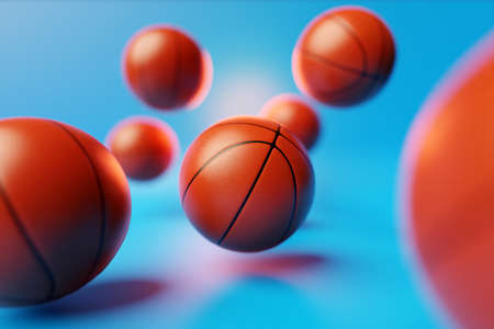 3d illustration of basketball balls. A lot of orange basketball balls are flying on a blue isolated background. Realistic render with sport ballsの写真素材